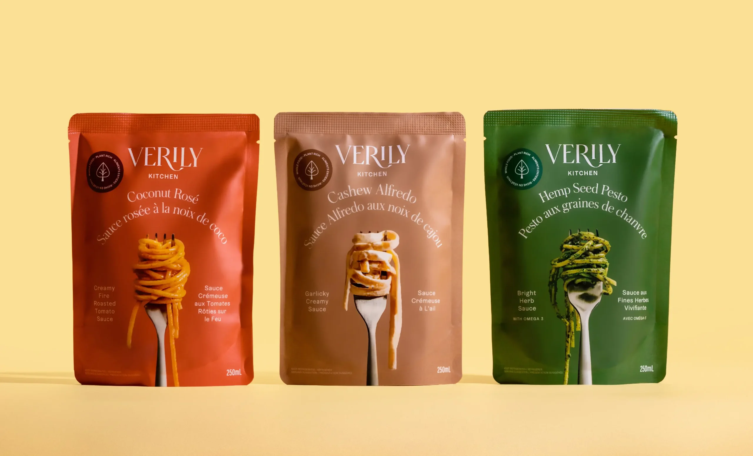 The packaging design landscape is often a feast for the eyes, with designers continuously pushing boundaries to create visually stunning and conceptually powerful work. One such standout example comes from Glasfurd and Walker, a renowned design agency known for crafting memorable brand stories through innovative design. Their latest project, Verily Kitchen, is a testament to their expertise and creativity.Verily Kitchen is a brand of flavorful spaghetti sauces that marries great taste with exquisite design. Glasfurd and Walker were tasked with creating packaging designs for the brand's three delectable flavors: hemp seed pesto, coconut rose, and cashew alfredo. The result is a visual delight that matches the sensory pleasure of the sauces themselves.The designs boast a distinctive artistry, with each box featuring bold, vibrant colors that correspond to the flavor within. The hemp seed pesto box is a lush green, reflecting the earthy, herbal notes of the sauce. The coconut rose flavor is signified by a delicate pink hue, capturing the light, fragrant essence of the sauce. Meanwhile, the cashew alfredo's rich, nutty flavor is symbolized by a bold yellow shade.Alongside these color palettes, each box also features bespoke illustrations that evoke a sense of the sauce's texture and ingredients, providing a visual feast that reflects the culinary delight inside. The designs effectively convey the unique selling points of each sauce, making for a truly memorable unboxing experience.