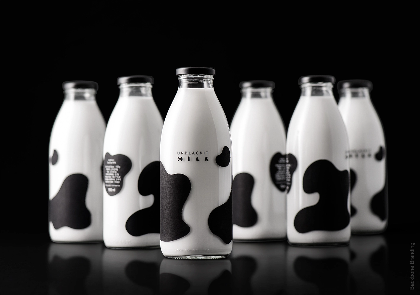 a Design Company Called  Backbone Branding they created PACKAGING Designs For Milk Company Called Unblackit Milk
